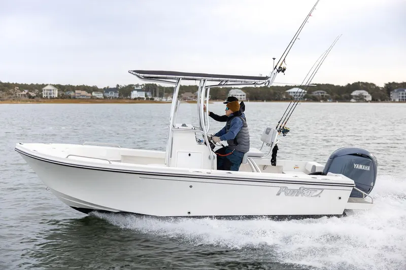 The Image of 2026 Parker 180 Coastal Elite boat on trailer, parked outdoors under blue sky. - 0