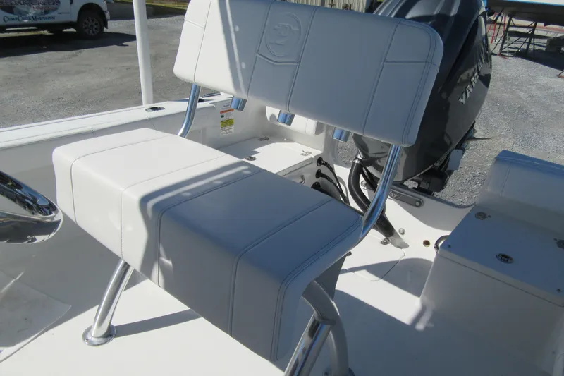 Slide: The Image of 2026 Parker 180 Coastal Elite boat interior with white seating and Yamaha engine. - 10