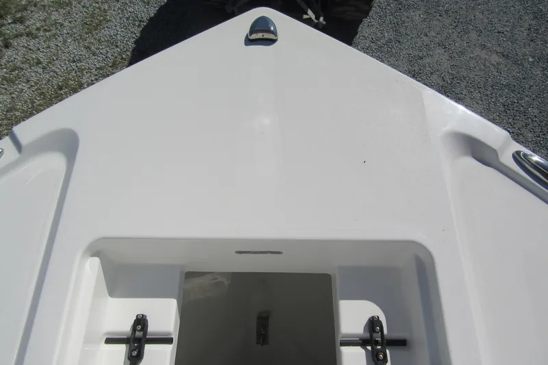 Slide: The Image of 2026 Parker 180 Coastal Elite boat deck, featuring a storage compartment and sleek design. - 9