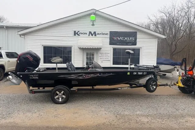 Slide: The Image of 2012 Lowe Stinger 18 HP boat parked outside Knox Marine dealership. - 1