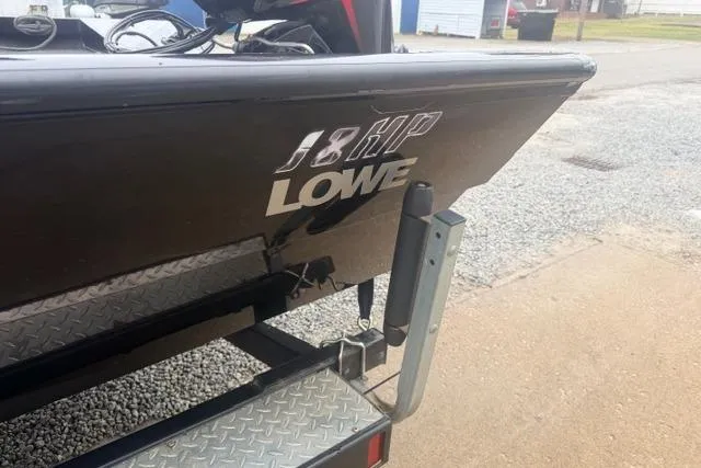 Slide: The Image of 2012 Lowe Stinger 18 HP boat on trailer, rear view. - 13