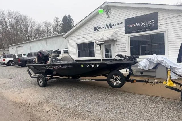 Slide: The Image of 2012 Lowe Stinger 18 HP boat on trailer outside Knox Marine dealership. - 2