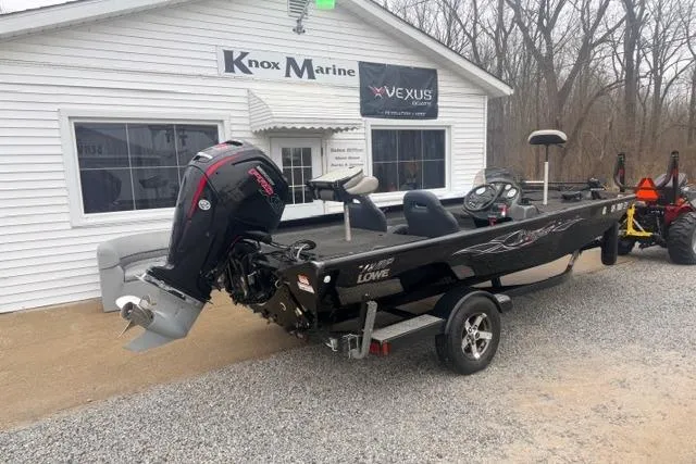 Slide: The Image of 2012 Lowe Stinger 18 HP boat on trailer outside Knox Marine dealership. - 3