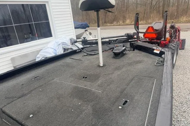 Slide: The Image of 2012 Lowe Stinger 18 HP boat deck with fishing seat and equipment. - 8