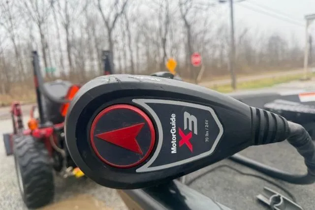 Slide: The Image of MotorGuide X3 trolling motor on 2012 Lowe Stinger 18 HP boat, outdoor setting. - 9