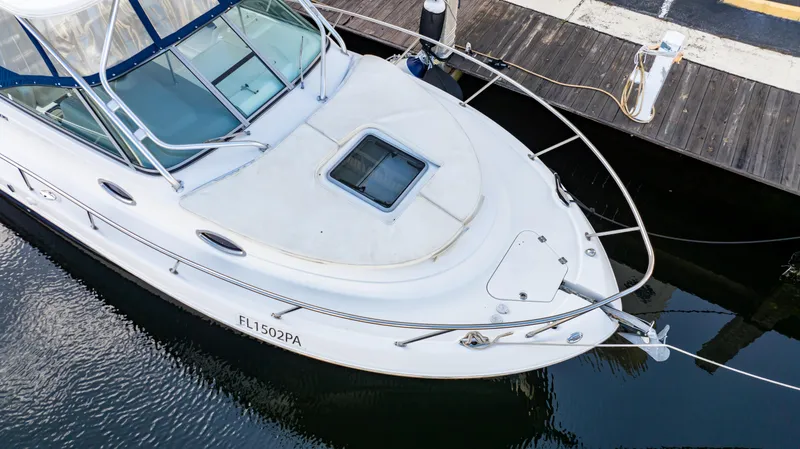 Slide: The Image of 2010 Robalo R305 Walkaround boat docked at marina, aerial view. - 11