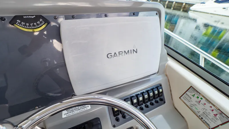 Slide: The Image of Garmin navigation system on 2010 Robalo R305 Walkaround boat dashboard. - 16