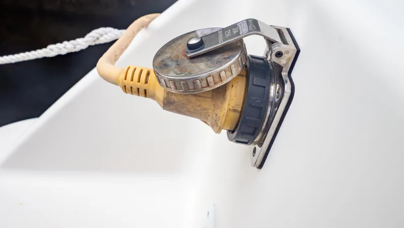 Slide: The Image of Close-up of a 2010 Robalo R305 Walkaround boat's power connection. - 19