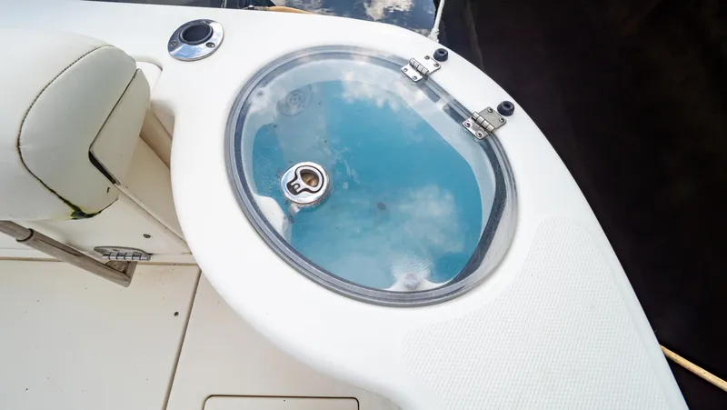 Slide: The Image of 2010 Robalo R305 Walkaround boat with livewell and seating. - 20