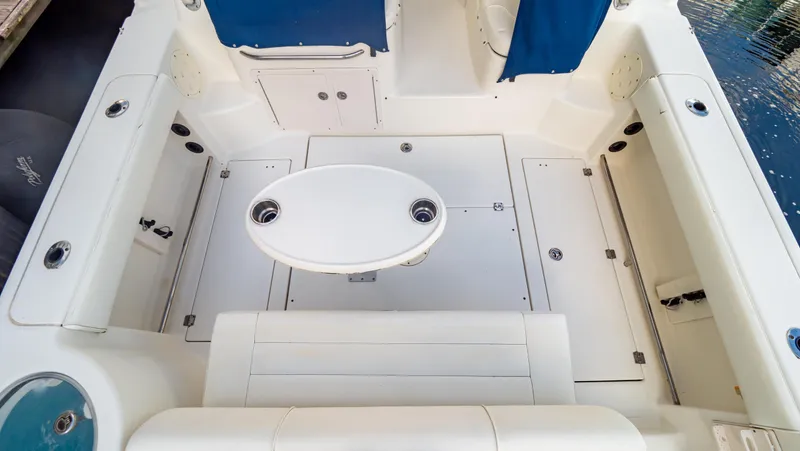Slide: The Image of 2010 Robalo R305 Walkaround boat deck with seating and table. - 29