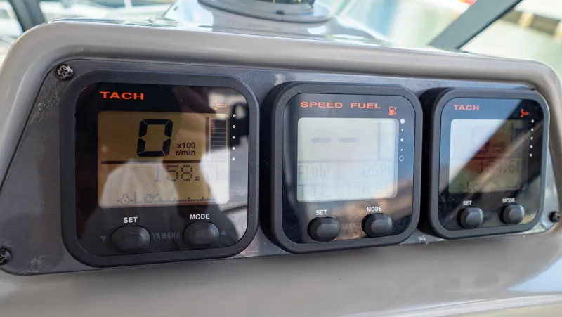 Slide: The Image of Dashboard of 2010 Robalo R305 Walkaround with tachometer and speed fuel gauges. - 38