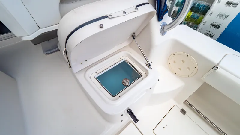 Slide: The Image of Open storage compartment on 2010 Robalo R305 Walkaround boat deck. - 47