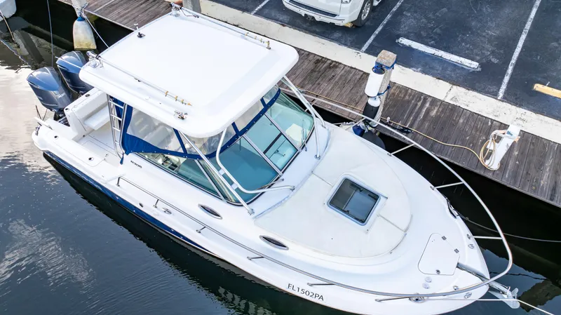 Slide: The Image of 2010 Robalo R305 Walkaround boat docked at marina, aerial view. - 6