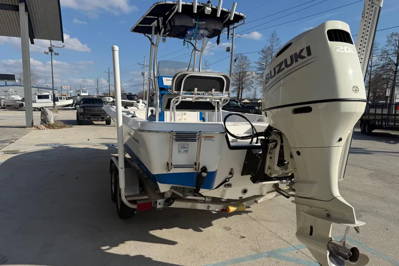 Slide: The Image of 2020 Aquasport 224 Bay boat with Suzuki 200 outboard motor on trailer. - 4