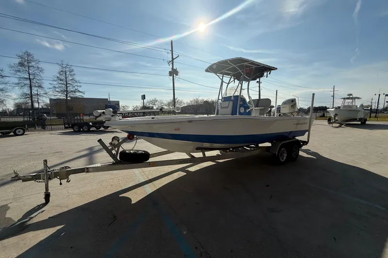 Slide: The Image of 2020 Aquasport 224 Bay boat on trailer in sunny outdoor setting. - 6