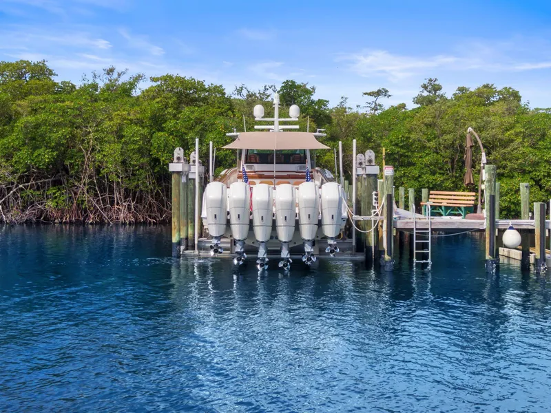 Slide: The Image of HCB 65 Estrella 2023 at dock with six outboard engines. - 10