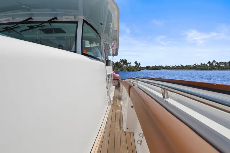 Slide: The Image of 2023 HCB 65 Estrella yacht deck with scenic water view. - 21