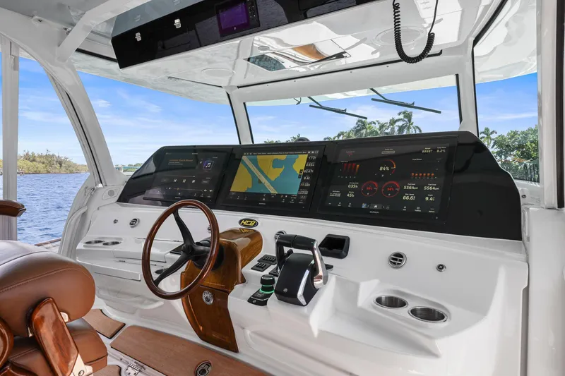 Slide: The Image of 2023 HCB 65 Estrella helm with advanced navigation displays and luxurious steering wheel. - 23