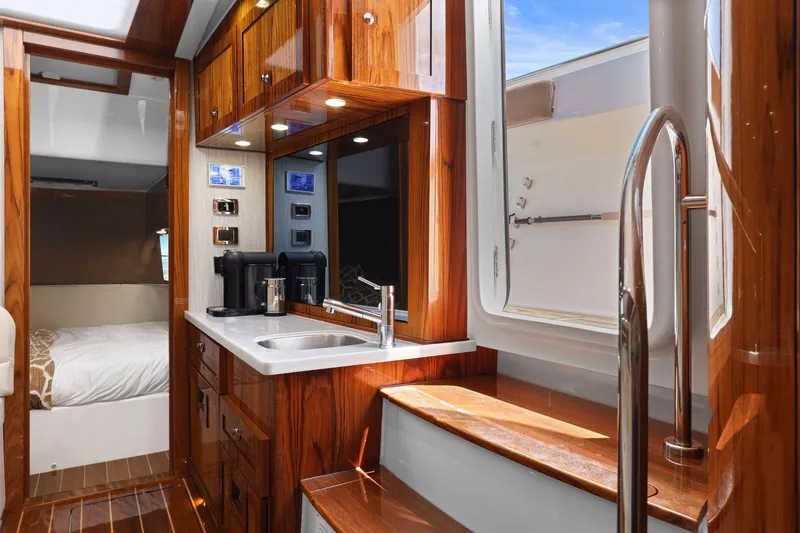 Slide: The Image of Luxurious interior of 2023 HCB 65 Estrella yacht with wood finishes and modern amenities. - 39