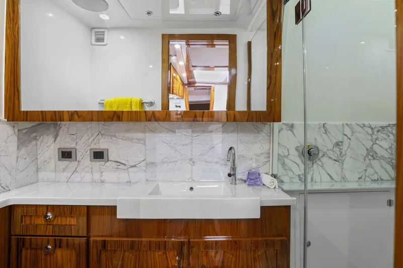 Slide: The Image of Luxurious bathroom in 2023 HCB 65 Estrella yacht with marble and wood finishes. - 47