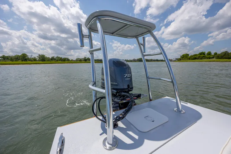 Slide: The Image of Custom Carolina 18 Flats boat with Yamaha 70 engine on a sunny day. - 23