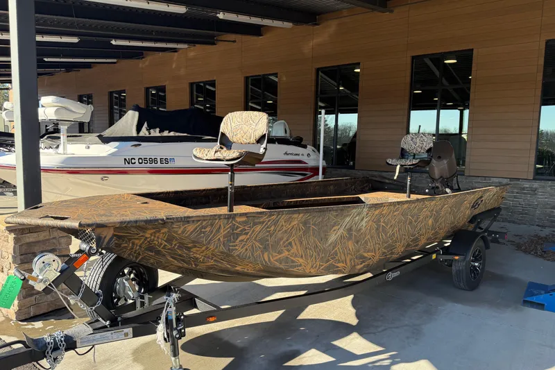 The Image of 2026 G3 Gator Tough 17 DK boat with camouflage design on a trailer. - 0