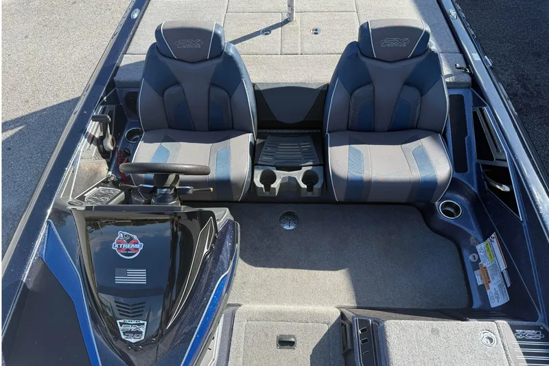 Slide: The Image of 2018 Skeeter FX20 boat interior with dual seats and steering console. - 6