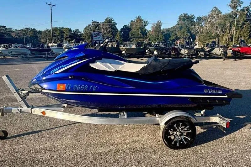 The Image of 2024 Yamaha WaveRunner GP SVHO in blue on a trailer, parked outdoors. - 0