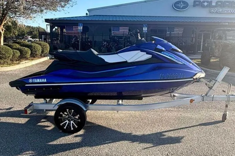 Slide: The Image of 2024 Yamaha WaveRunner GP SVHO on trailer, parked outside dealership. - 4