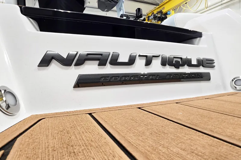 Slide: The Image of 2026 Nautique Super Air Nautique GS22 Coastal Edition logo on boat deck. - 5