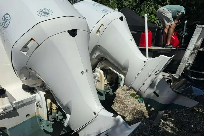 Slide: The Image of Twin Yamaha outboard engines on a 2017 Robalo R302 Center Console boat. - 7