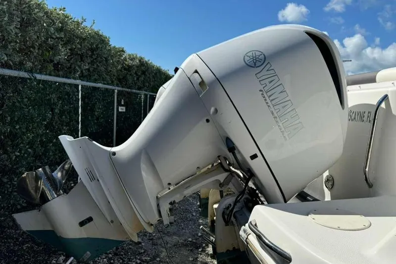 Slide: The Image of 2017 Robalo R302 Center Console with Yamaha outboard motor, parked outdoors. - 8