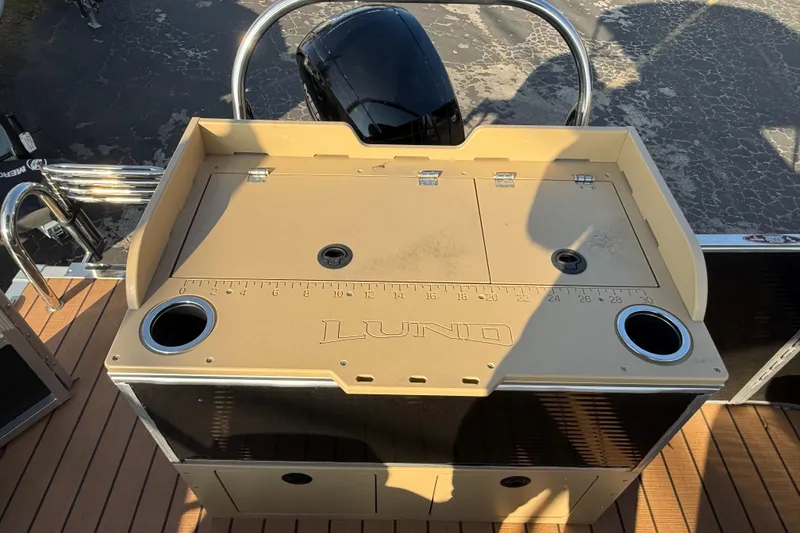 Slide: The Image of 2020 Lund LX220 Pontoon Fish boat with fishing station and measuring board. - 9