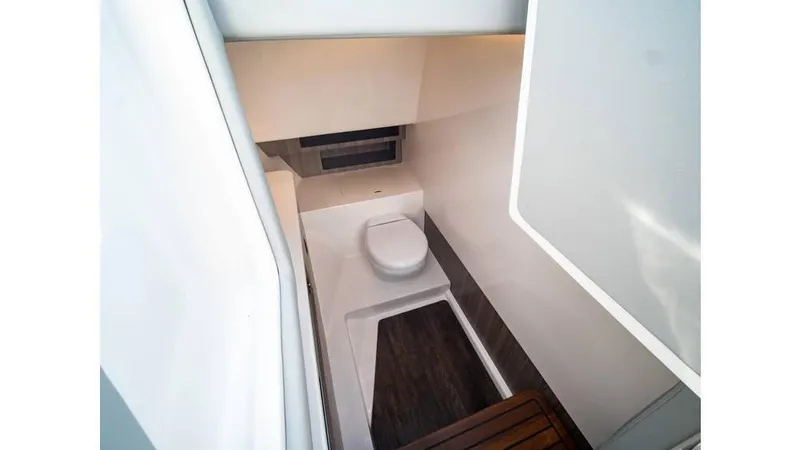 Slide: The Image of 2022 Regal LS36 boat interior bathroom with modern design and compact layout. - 15