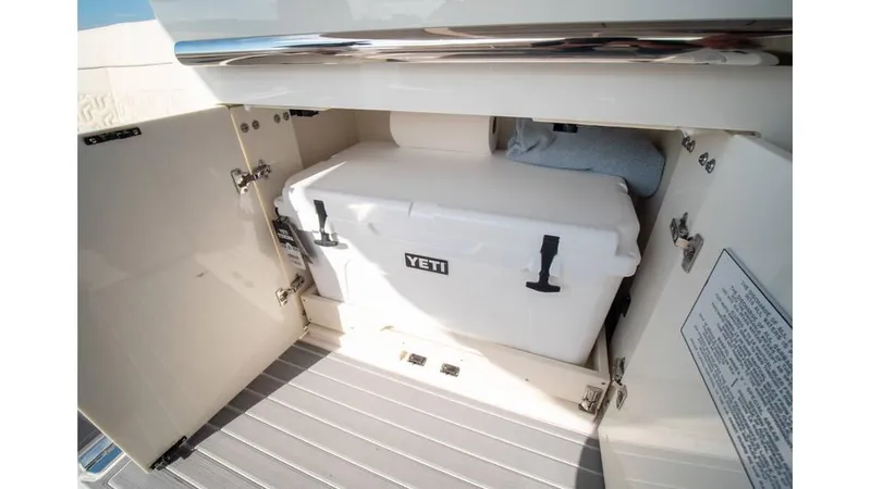 Slide: The Image of Regal LS36 2022 boat storage with Yeti cooler in compartment. - 16