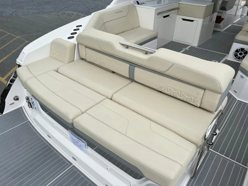 Slide: The Image of Luxurious seating on 2022 Regal LS36 boat with beige upholstery. - 28