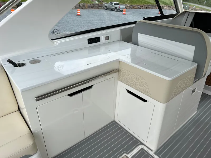 Slide: The Image of 2022 Regal LS36 boat interior with sleek white cabinetry and modern design. - 31
