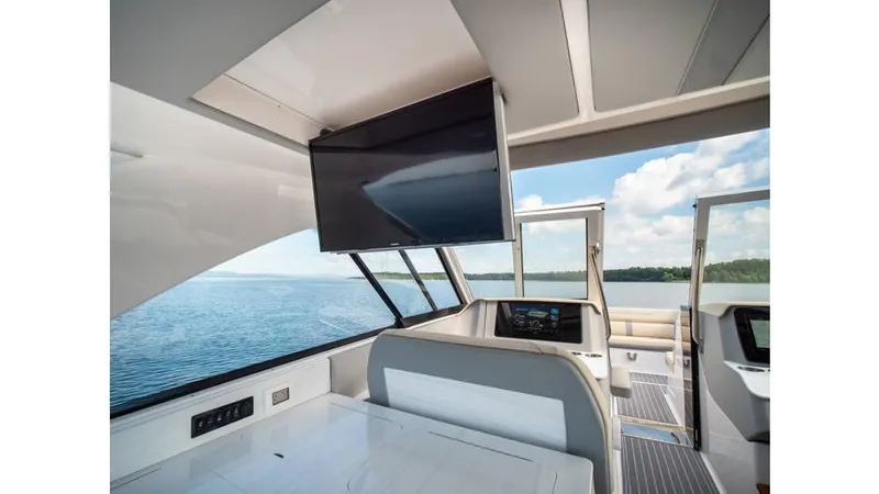 Slide: The Image of Interior of 2022 Regal LS36 yacht with TV and scenic water view. - 5