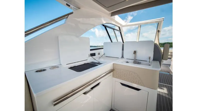 Slide: The Image of 2022 Regal LS36 yacht interior with modern kitchen and sleek design. - 7