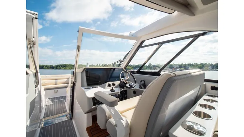 Slide: The Image of Interior of 2022 Regal LS36 boat with modern helm and seating. - 8