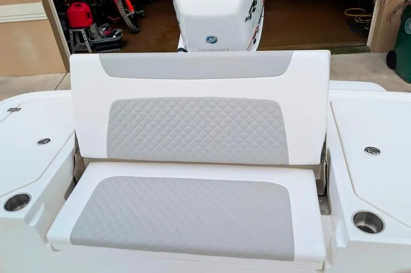 Slide: The Image of 2021 Caymas 26 HB boat seat with quilted design and cup holders. - 11