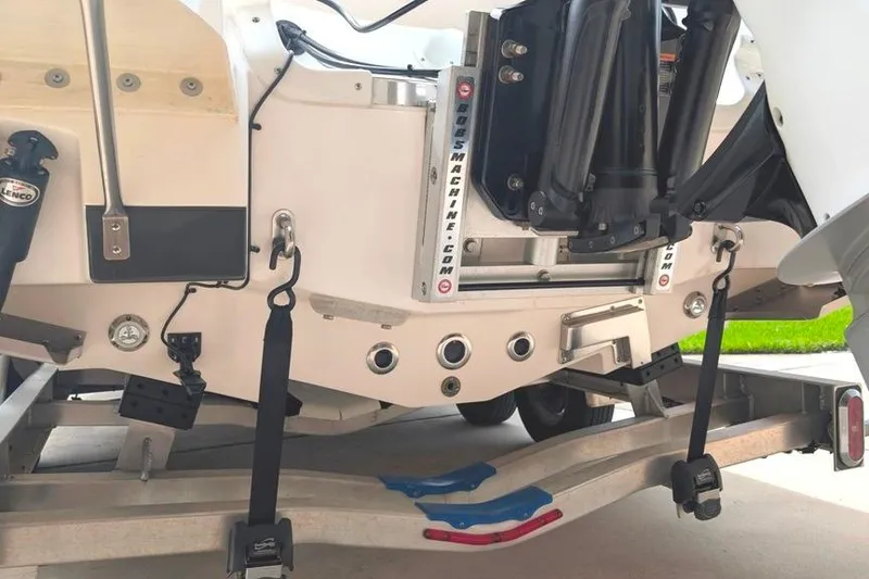 Slide: The Image of 2021 Caymas 26 HB boat transom with trailer and hydraulic components. - 8