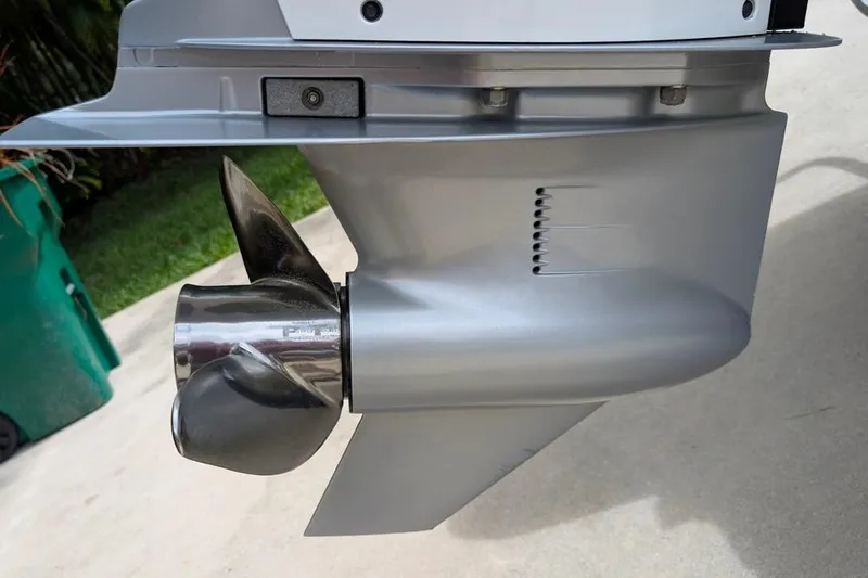 Slide: The Image of 2021 Caymas 26 HB boat propeller and lower unit close-up. - 9