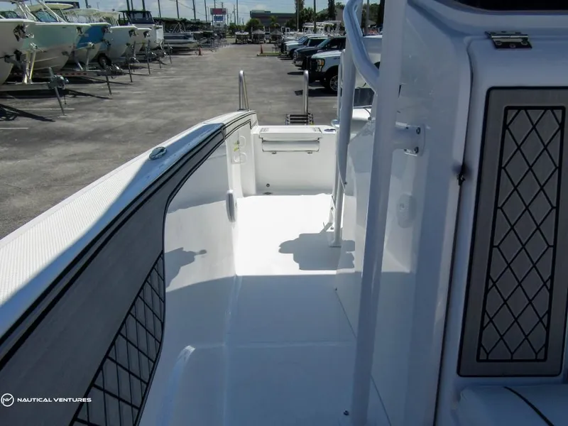 Slide: The Image of 2024 Wellcraft 202 Fisherman boat interior, showcasing spacious deck and modern design. - 12