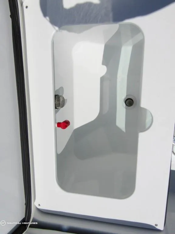 Slide: The Image of 2024 Wellcraft 202 Fisherman boat storage compartment. - 24