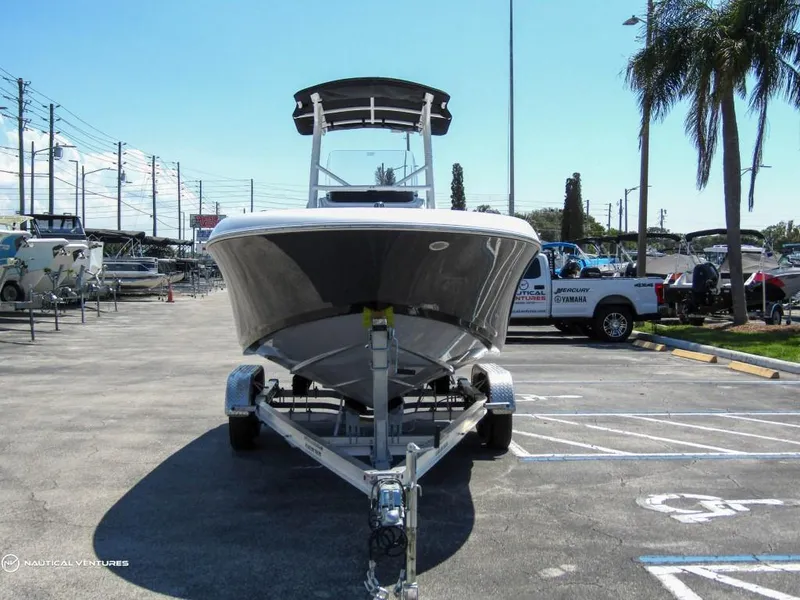 Slide: The Image of 2024 Wellcraft 202 Fisherman boat on trailer in parking lot. - 3