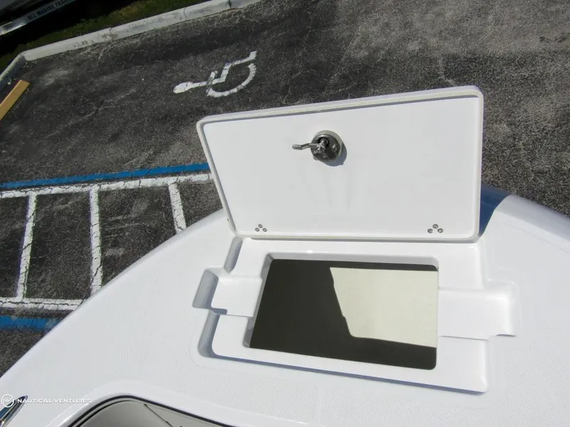 Slide: The Image of Open storage compartment on the 2024 Wellcraft 202 Fisherman boat. - 5