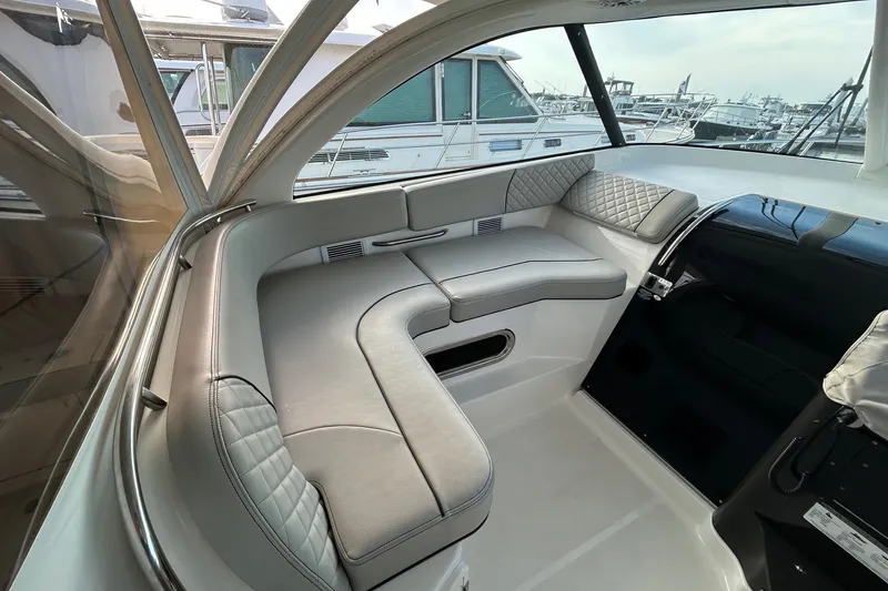 Slide: The Image of 2023 Pursuit OS 385 Offshore interior with elegant seating and modern design. - 2