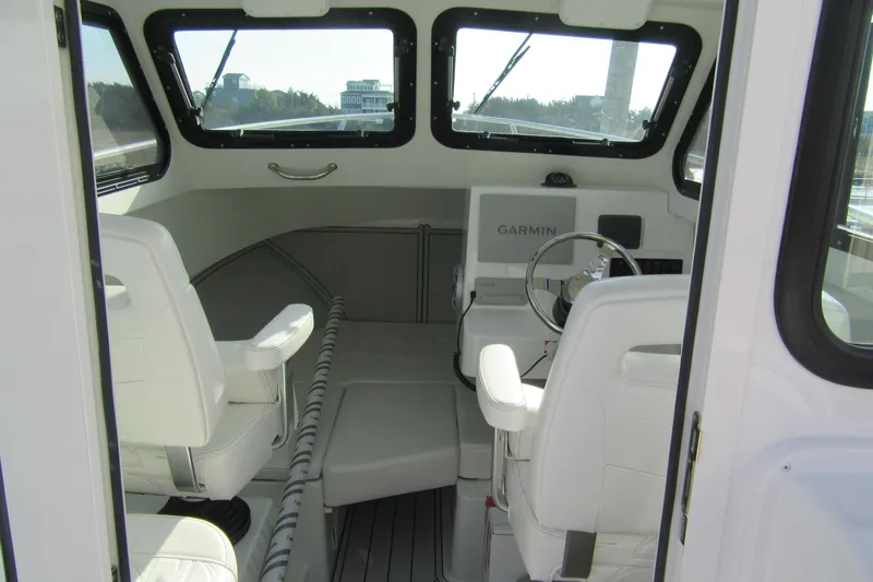 Slide: The Image of Interior of 2026 Parker 227 Explorer Sport Cabin with Garmin navigation system. - 12