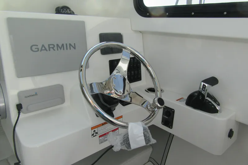 Slide: The Image of Steering console of 2026 Parker 227 Explorer Sport Cabin with Garmin navigation system. - 14